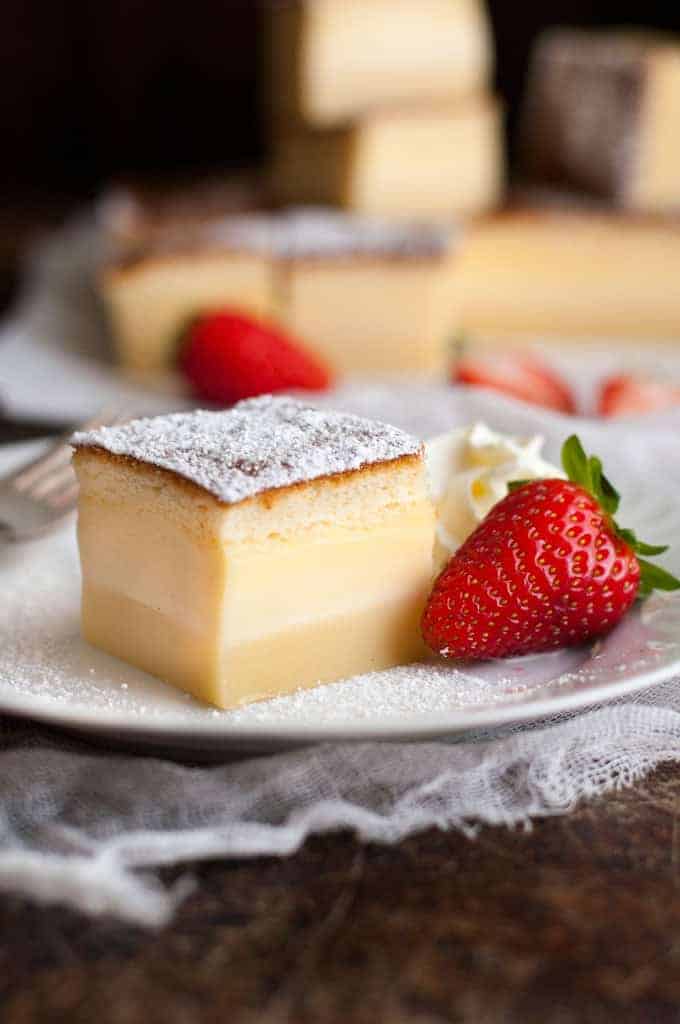 Magic Custard Cake - one simple batter transforms into a 3 layered cake! A fudgey base, soft custard middle and fluffy sponge topping.