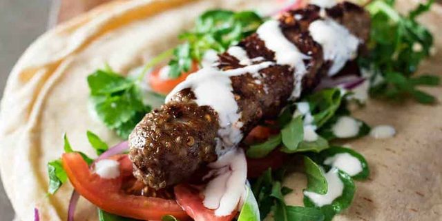 Turkish Lamb Kebab Kofta on pita with vegetables and yoghurt sauce