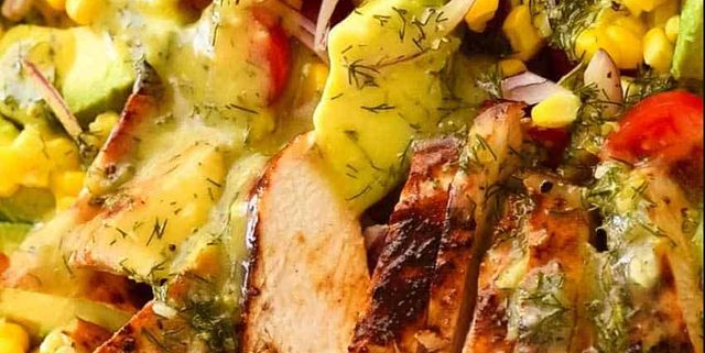 Close up of Lemon Chicken Salad with avocado, tomatoes and corn with lemon dill dressing.