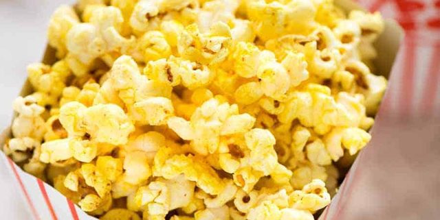 Yellow Homemade Movie Popcorn in a popcorn bucket