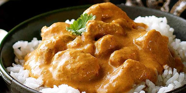 Butter Chicken served over basmati rice in a bowl, ready to be served
