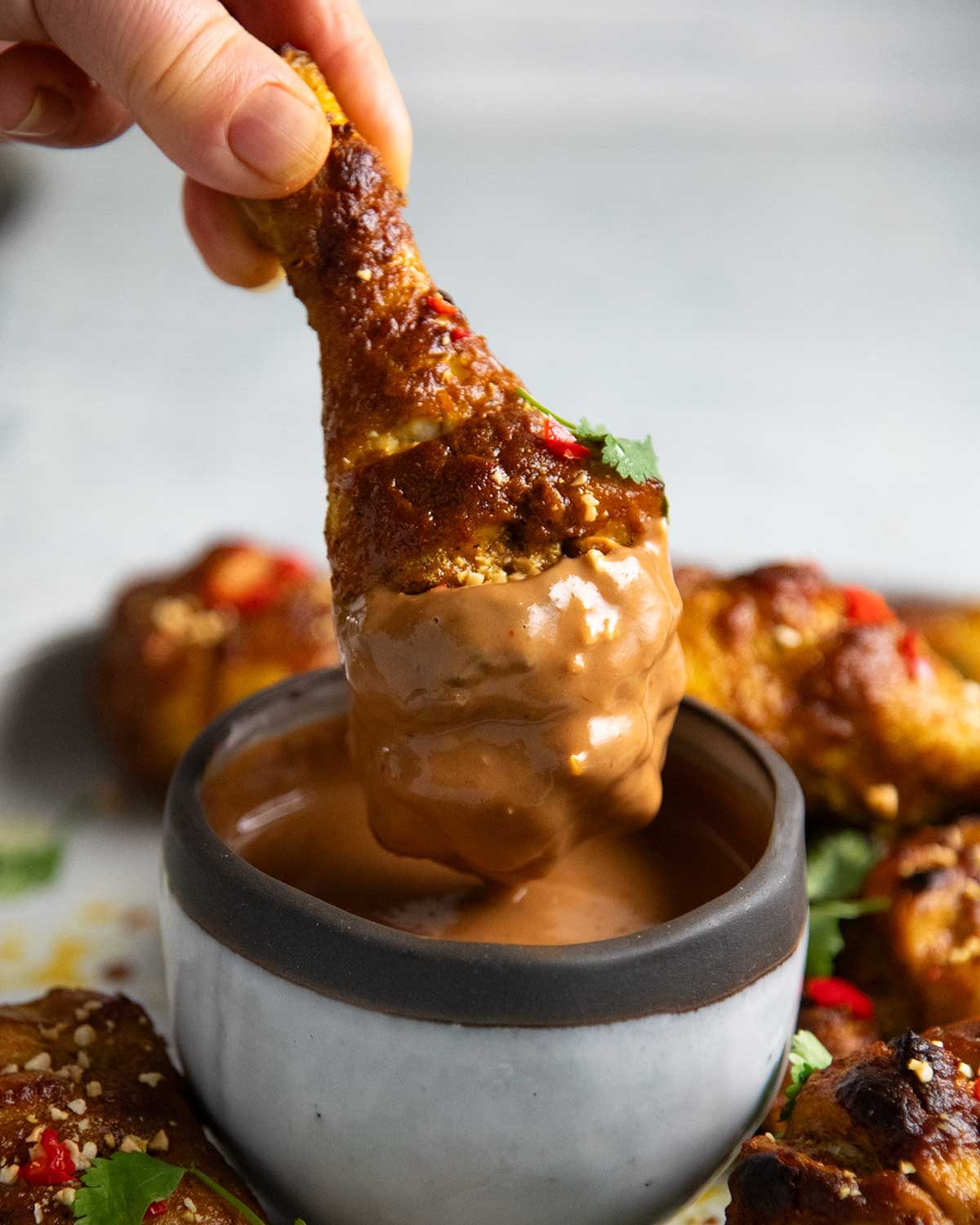Satay chicken legs with peanut sauce