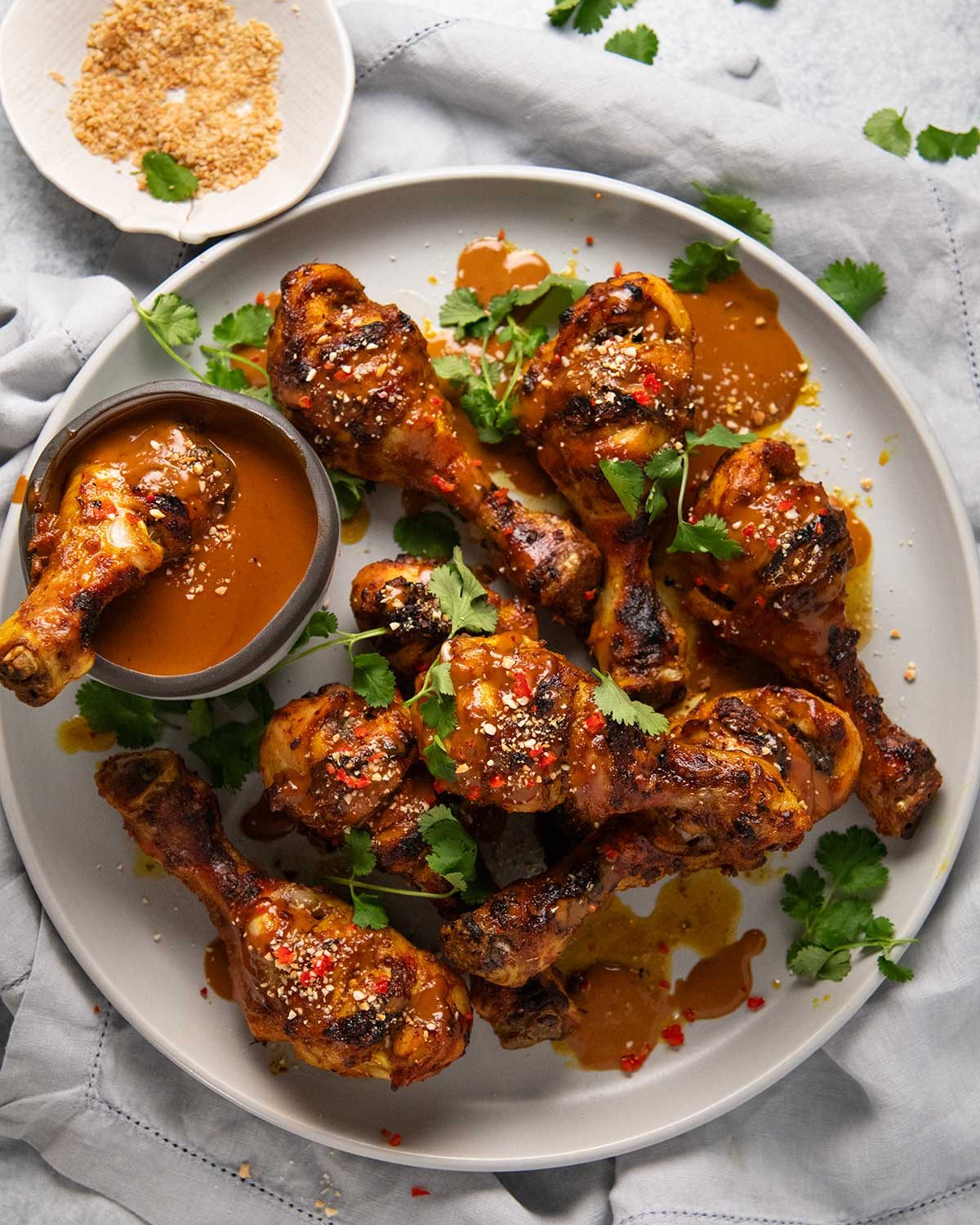 Satay chicken legs with peanut sauce