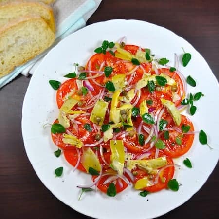 Tomato and Artichoke Salad - this takes mere minutes to prepare and you won't believe how incredible the flavour of the tomatoes are. Easily adaptable to whatever you have on hand, just use this recipe as a guide.