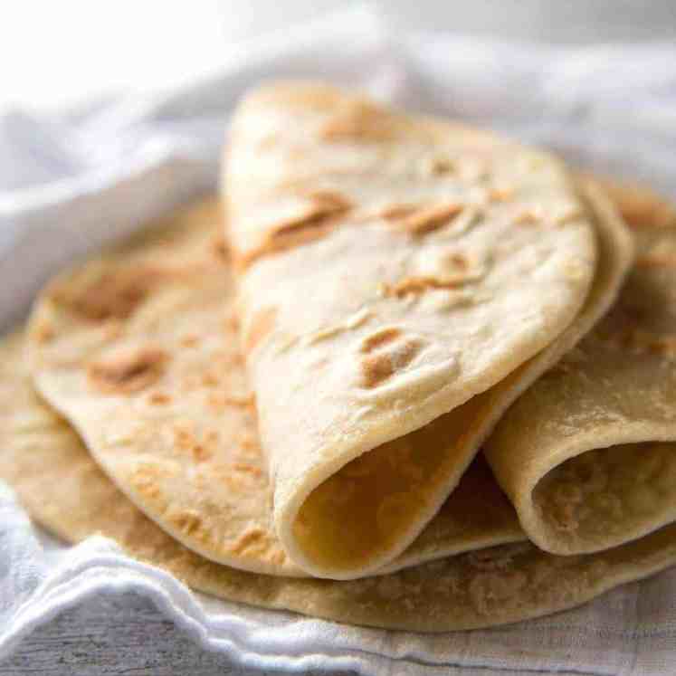 This flatbread recipe is made without yeast, yet is soft and pliable and wonderfully moist. www.recipetineats.com