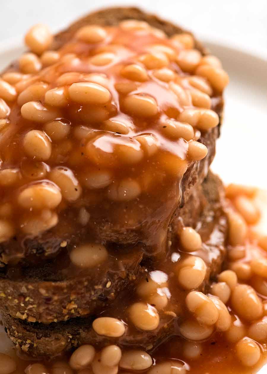 Close up of homemade baked beans recipe, piled onto toast