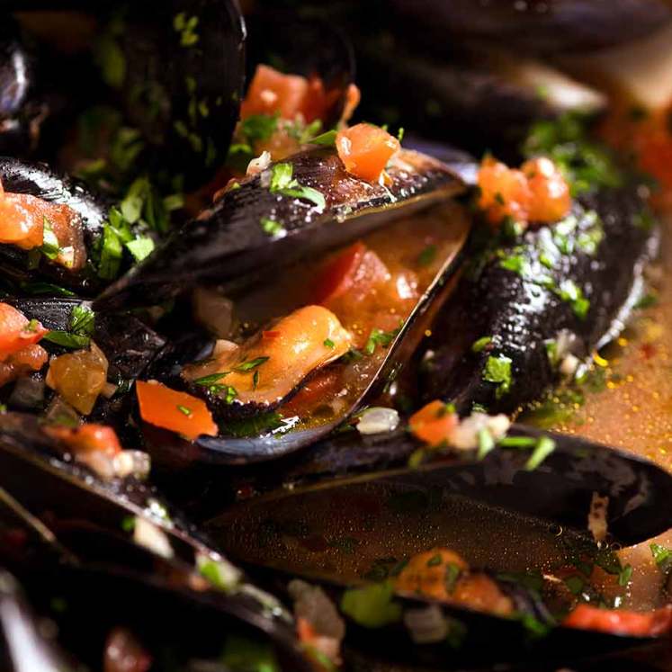 Close up of mussels with garlic white wine