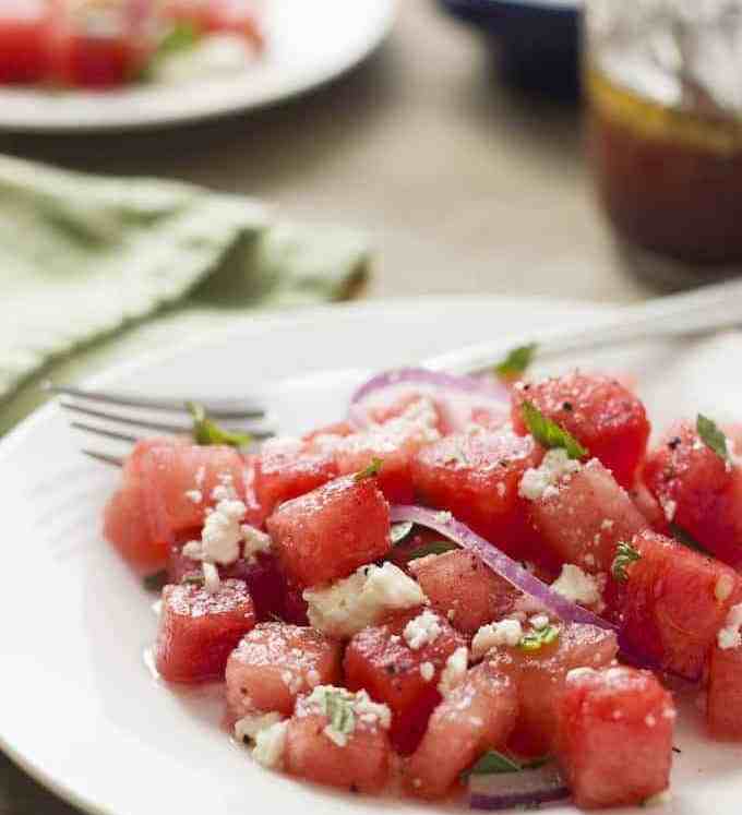 Watermelon Salad - as strange as it sounds, sweet, juicy watermelon with feta, red onion and mint is a winning combination. This summery, light salad is refreshing and is perfect for a summer barbeque.