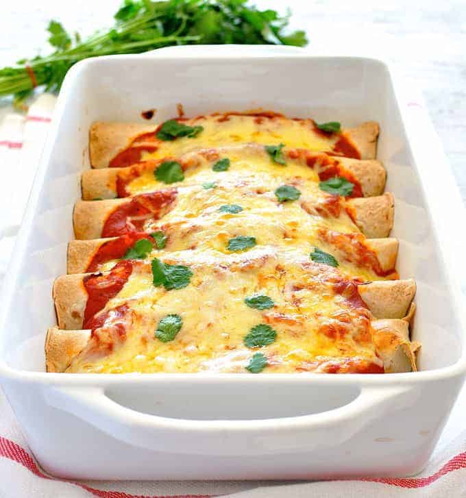 Use leftover Pork Carnitas (or sub with chicken) to make this 10 minute prep Enchiladas! #mexican #easy #tortillas