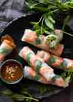 Jam packed with fresh, bright flavours, learn how to make Vietnamese Rice Paper Rolls with an easy to follow video tutorial and step by step photos. Served with an addictive Vietnamese Peanut Dipping Sauce! www.recipetineats.com