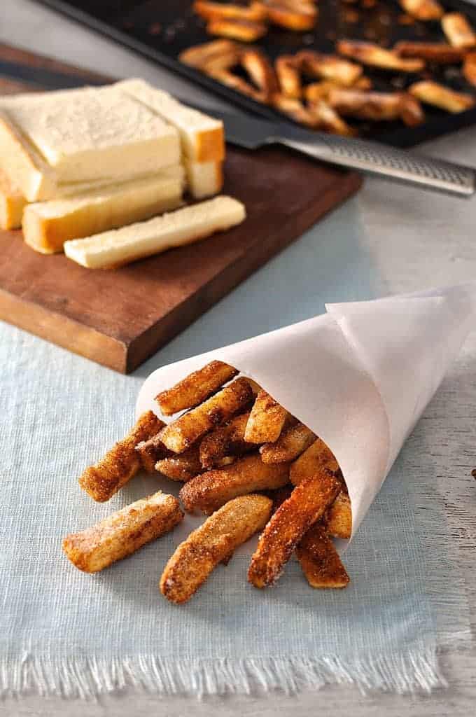 Cinnamon Sugar Bread Crust Treats in a paper cone