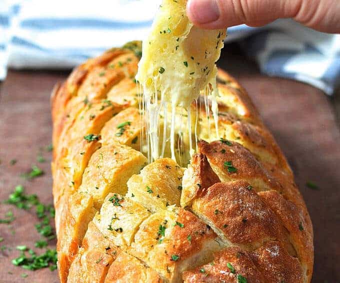 Cheese and garlic crack bread - this cheesy garlic bread is outta this world! recipetineats.com