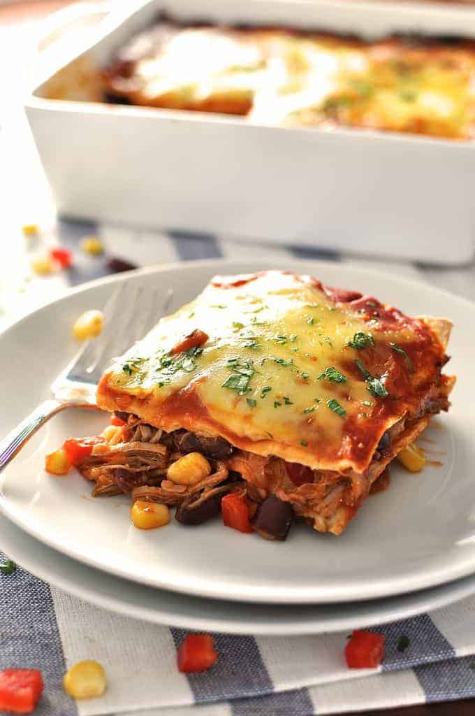 10 minutes to assemble, it's an enchilada - layered up like lasagna! Great for freezing, either before or after baking. #enchilada #mexican #lasagna