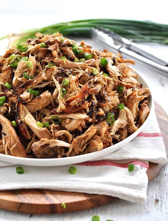 Pile of crispy Slow Cooker Chinese Shredded Chicken on a white plate