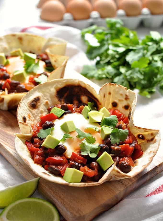 Tortilla bowls that are perfect for tearing bits off to scoop up the tomato bean filling and egg! #mexican #breakfast #brunch #tortilla #huevos_racnheros