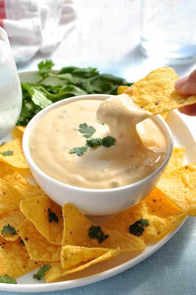 Nachos Cheese Dip that stays silky smooth even when it cools! Just 5 min to make, without using processed cheese! recipetineats.com