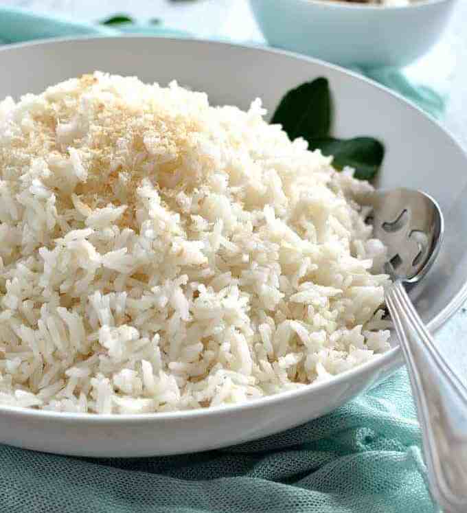 Fluffy coconut rice in a white bowl, ready to be served.