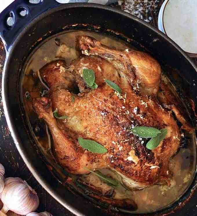 Jamie Oliver's Chicken in Milk in a casserole pot, fresh out of the oven ready for serving.