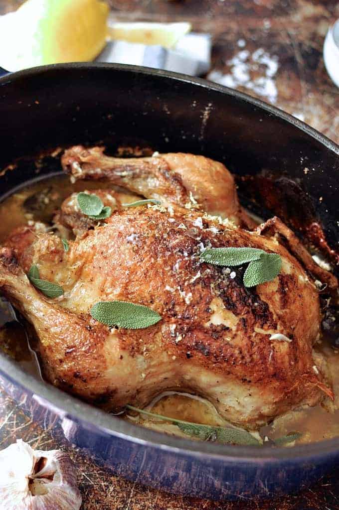 Close up of Jamie Oliver's Milk Chicken in a pan, fresh from the oven ready to serve.