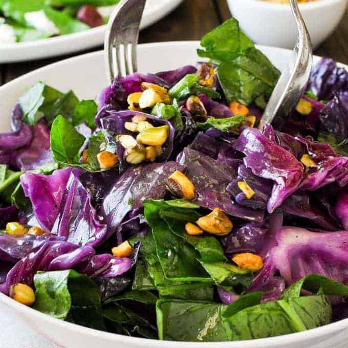 Warm Red Cabbage Salad with Garlic Butter being served