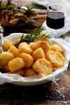Truly Crunchy Roast Potatoes - par boil, rough up the surface, dust with semolina then bake in a very hot oven in preheated oil. Based on a Nigella recipe.