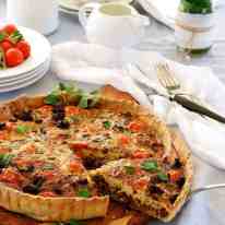 Table setting with whole Italian Sausage Quiche