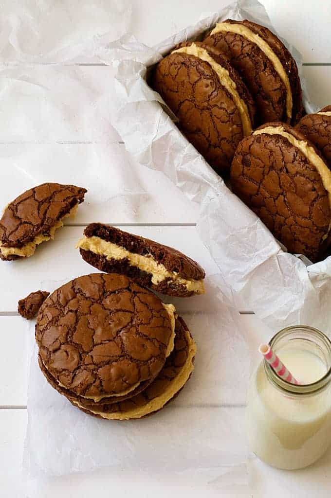 Brownie Cookie Sandwiches with Peanut butter Frosting, with milk bottle