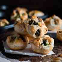 A pile of Ricotta and Spinach Puff Pastry Bites