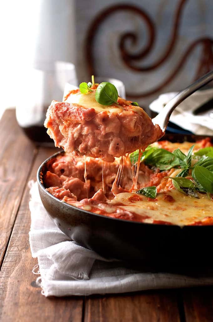 A scoop of Creamy Tomato Pasta Bake With Chicken