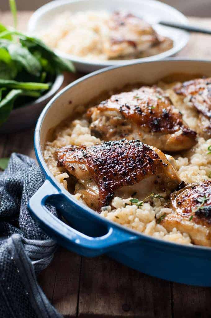 One Pot Creamy Baked Risotto with Lemon Pepper Chicken in a casserole pot