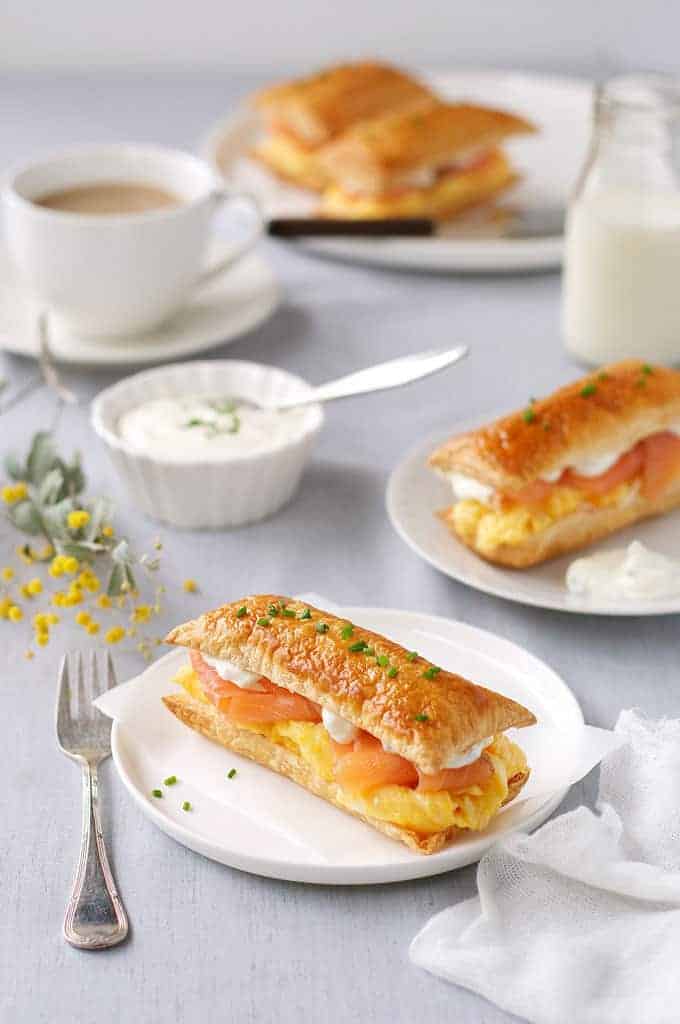 Breakfast table with Smoked Salmon and Egg Breakfast Mille-feuille and a cup of coffee