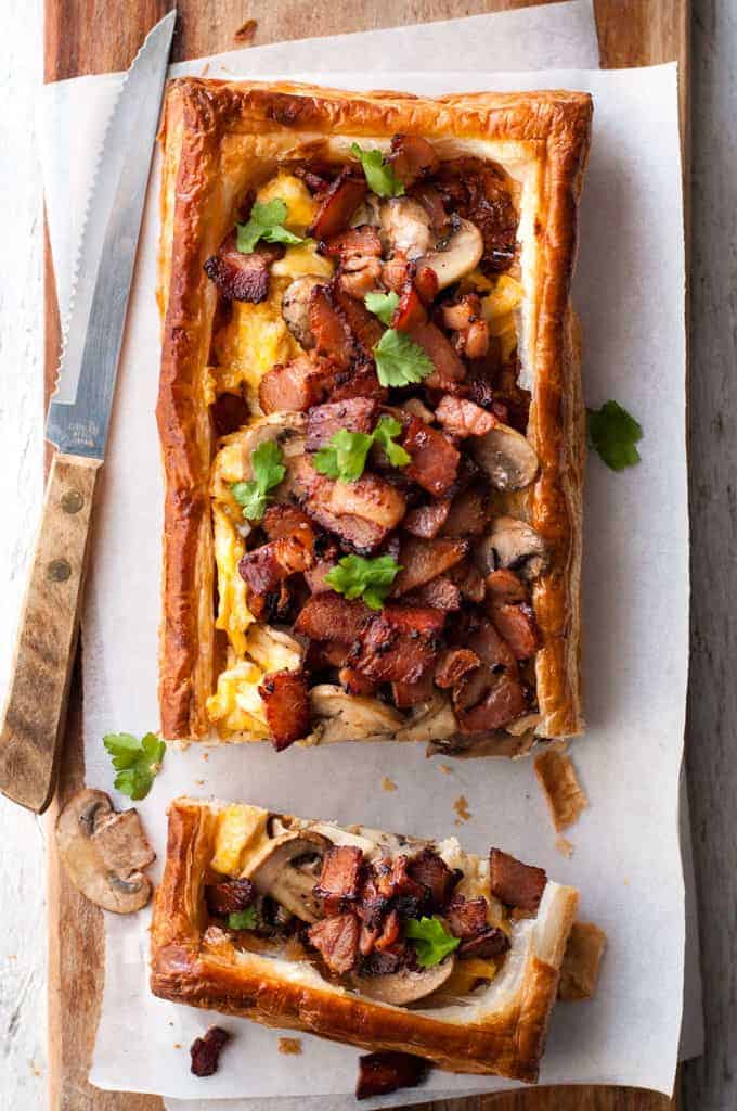 Bacon, Egg and Mushroom Tart on a wooden board