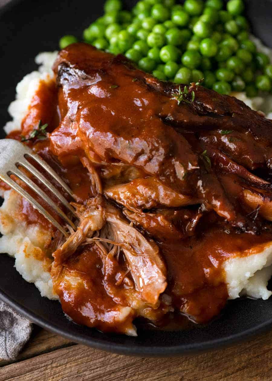 Close up of Slow Cooked Lamb Shanks in Red Wine Sauce, showing how tender the meat is