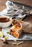 Freezer Friendly Shredded Mexican Beef Burritos - juicy, moist shredded beef with Mexican Red Rice and cheese wrapped in a tortilla.