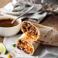 Freezer Friendly Shredded Mexican Beef Burritos - juicy, moist shredded beef with Mexican Red Rice and cheese wrapped in a tortilla.