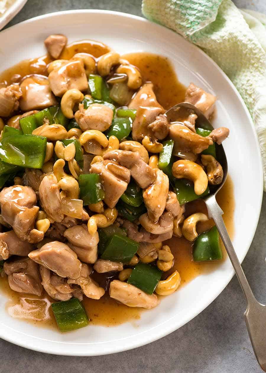 Chinese Cashew Chicken with sauce on a white plate, ready to be served