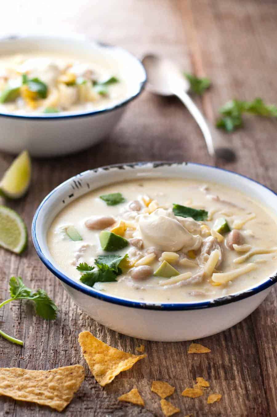 White Chicken Enchilada Soup in a bowl, ready to be eaten
