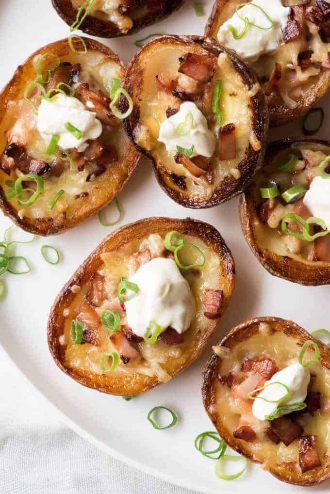Cheese & Bacon Potato Skins topped with sour cream