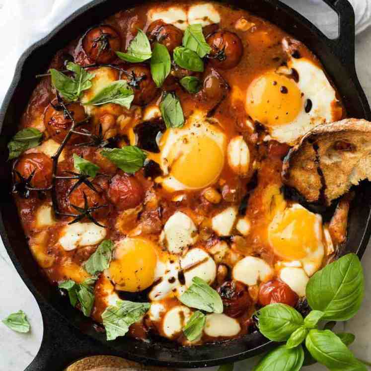 Caprese Baked Eggs drizzled with balsamic vinegar, with toast