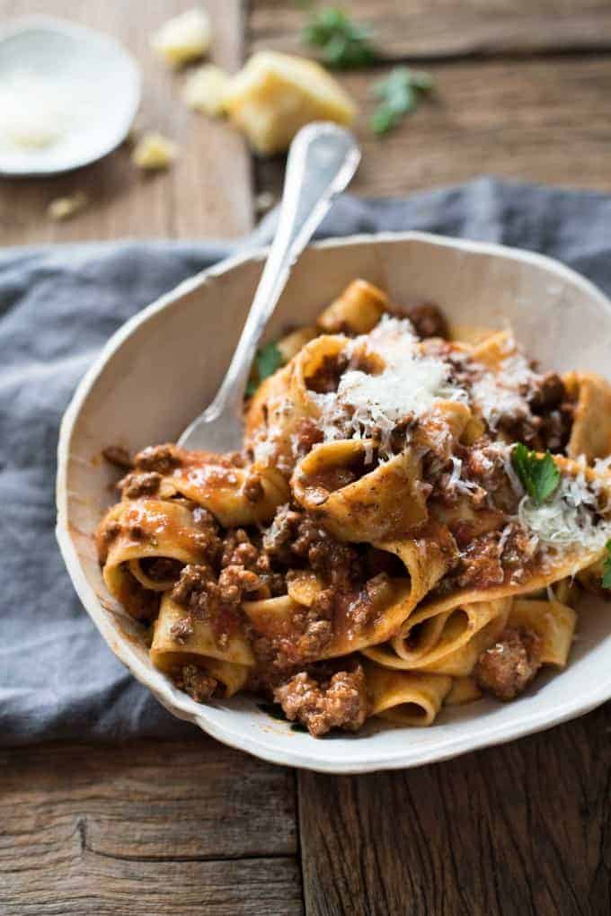 A bowl of Italian Sausage & Beef Ragu Sauce topped with grated parmesan
