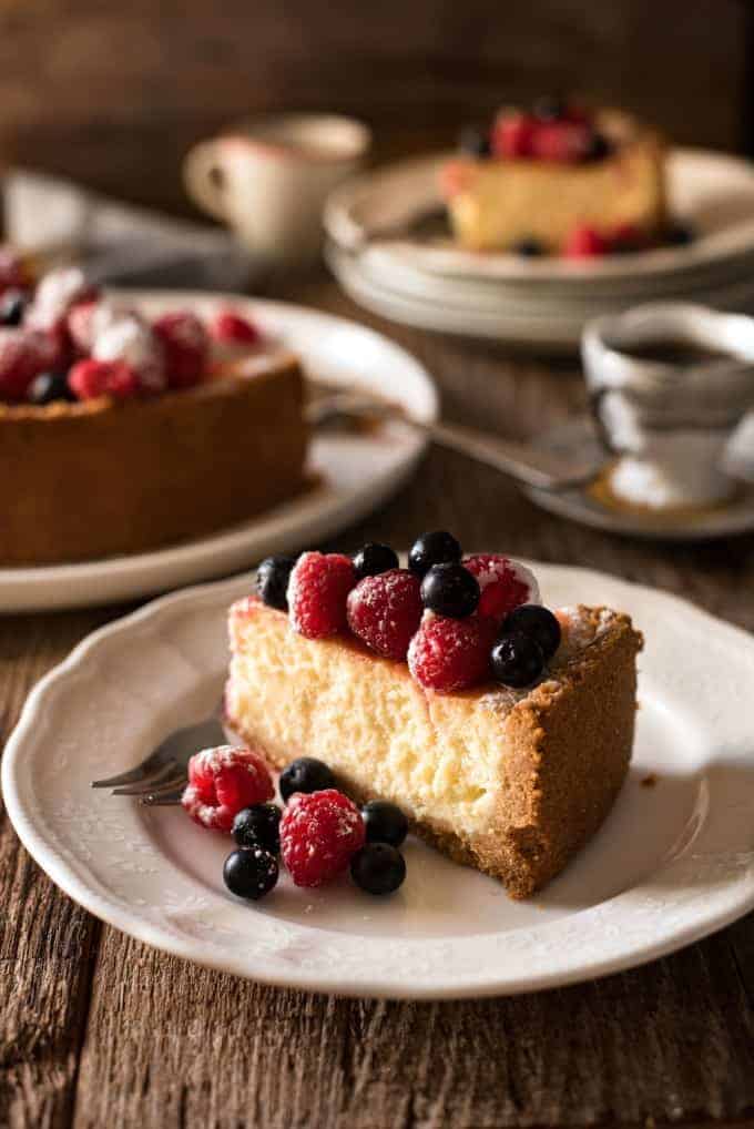 Easy Classic Baked Cheesecake - Creamy and rich, yet light, with a couple of secret tips, this is surprisingly easy to make! 