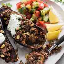 Moroccan Baked Eggplant with Beef with yoghurt topping and cucumber tomato salad
