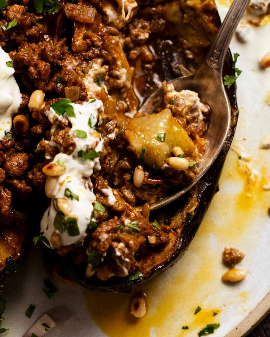 Scooping Moroccan stuffed eggplant - spiced beef or lamb
