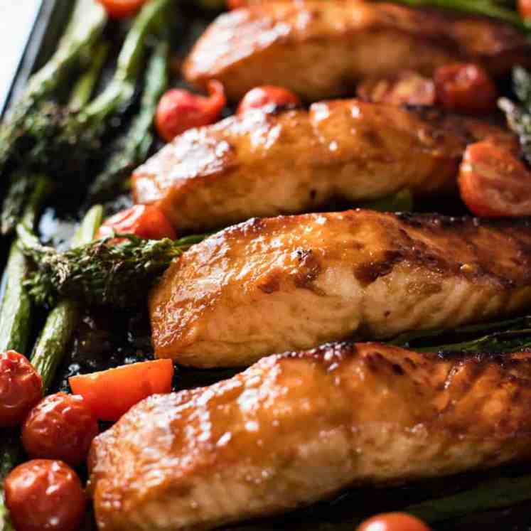 One Sheet Pan Brown Sugar Salmon & Vegetables - The glaze taste incredible and this whole dinner is ready in 15 minutes flat!