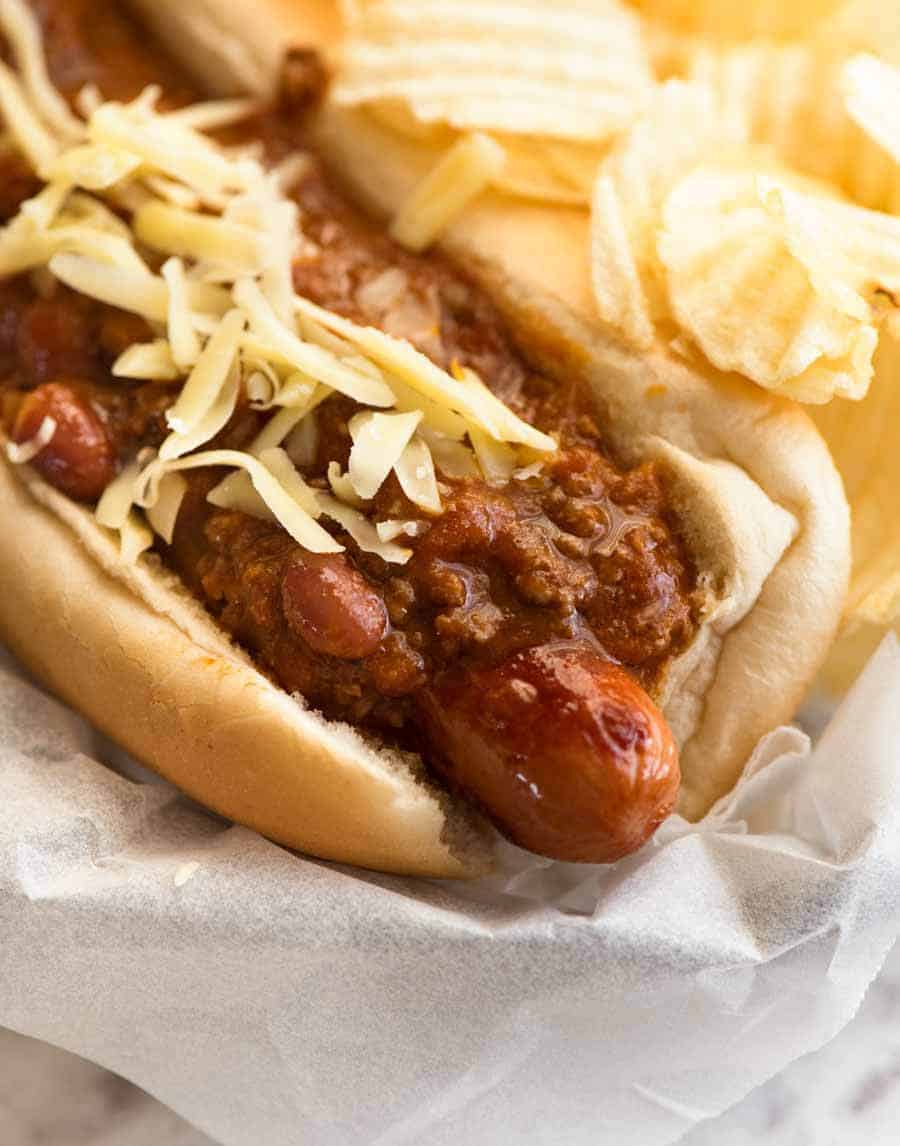 Close up of Chili Dog with a side of crisps