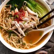 Overhead photo of Chinese Noodle Soup with chicken, noodles and buk choi