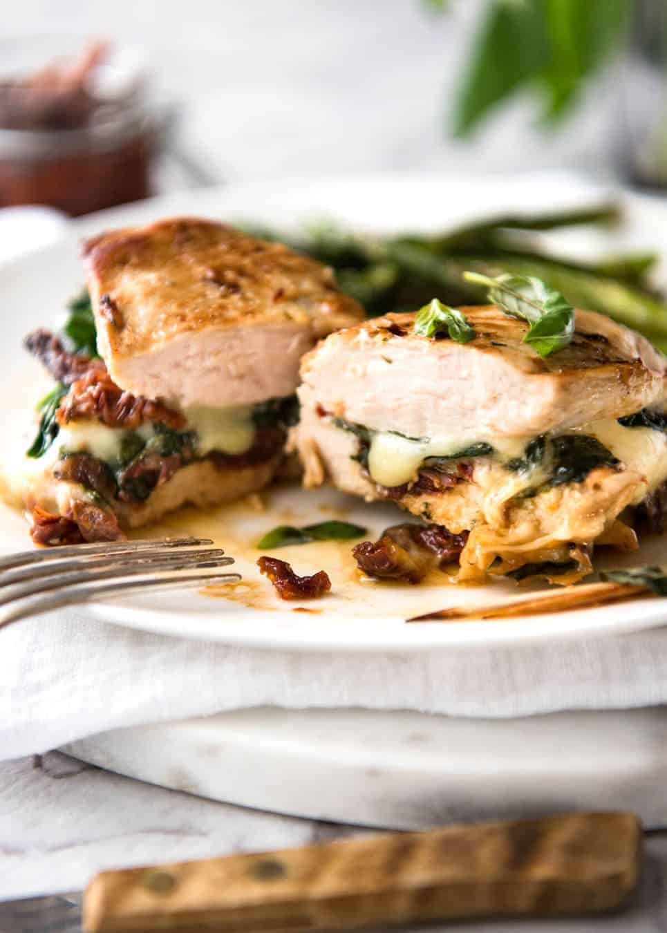 Baked Stuffed Chicken Breast - slathered in Italian flavours then stuffed with spinach, sun dried tomato and cheese. 5 minutes prep, no marinating required! recipetineats.com