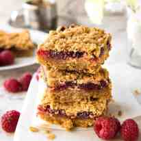 Raspberry Bars - One of the fastest bars to make from scratch, these have an oatmeal biscuit base, raspberry jam and a crumbly oatmeal topping. Just 10 minutes prep! recipetineats.com
