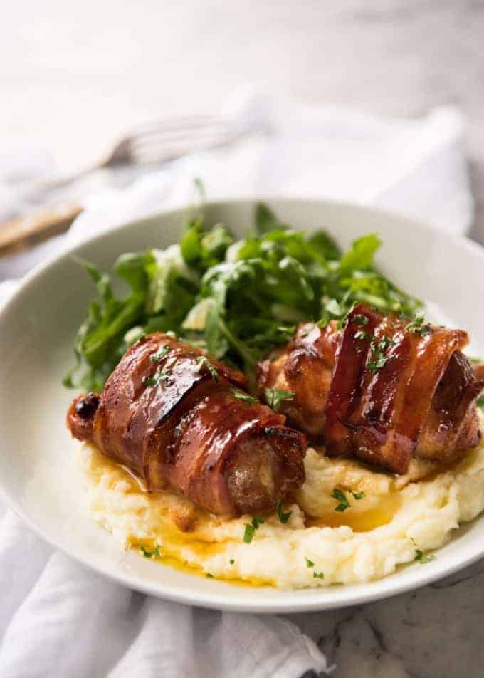 Bacon Wrapped Chicken - A spectacular way to dress up chicken with just a few simple ingredients! Brown sugar is the key to creating a gorgeous glaze on the bacon. recipetineats.com