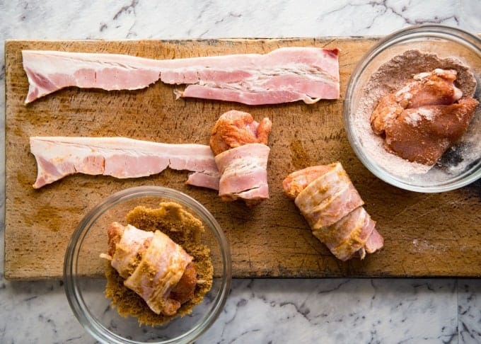 Bacon Wrapped Chicken - A spectacular way to dress up chicken with just a few simple ingredients! Brown sugar is the key to creating a gorgeous glaze on the bacon. recipetineats.com
